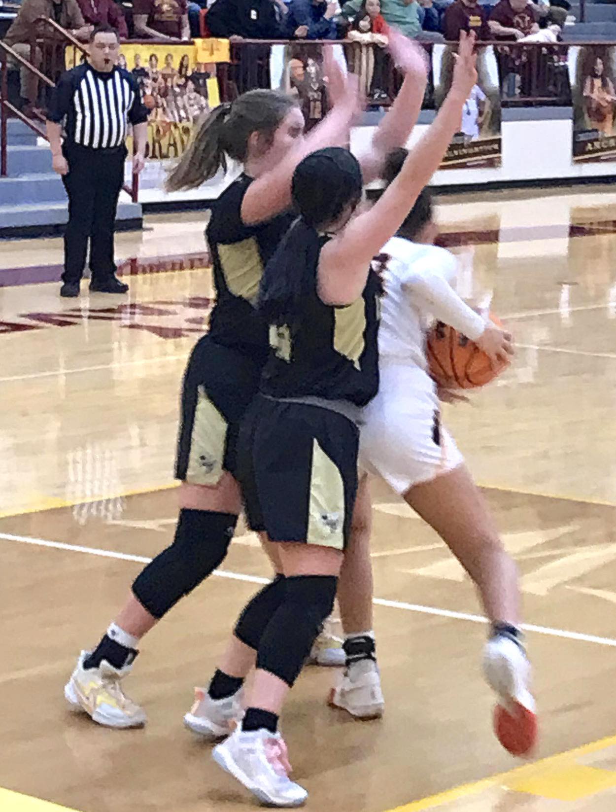 Gary Corsair • Clay County Progress Hayesville's Mallory Peck, No. 35, and Breanna Abrams, No. 4, form a wall to thwart a Cherokee drive to the basket.