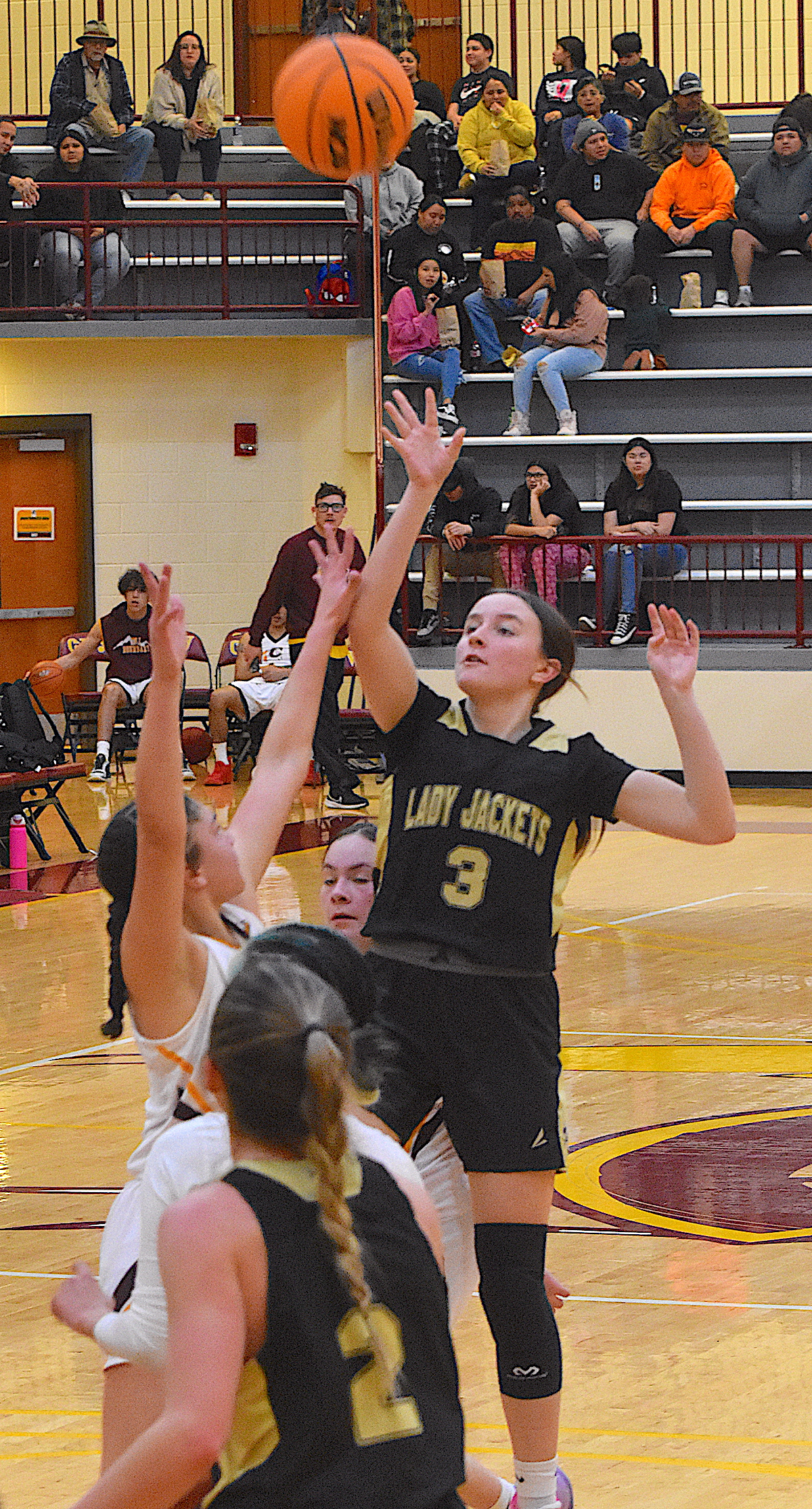 Hayesville guard Jasmine Brooks, No. 3, lofts a floater from the free throw line against Cherokee.