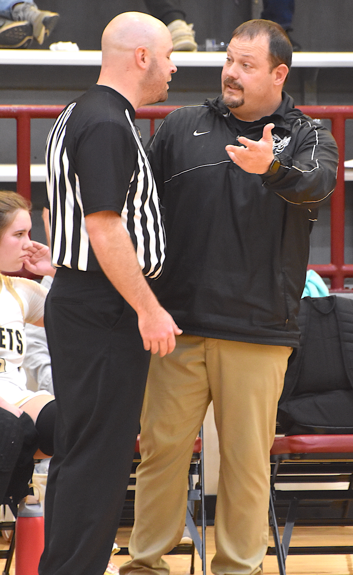 Gary Corsair• Clay County Progress Hayesville Coach Chad McClure questions a technical foul assessed to a Lady Yellow Jacket involved in a tussle for a rebound during the closing minutes of the varsity's win over Robbinsville.