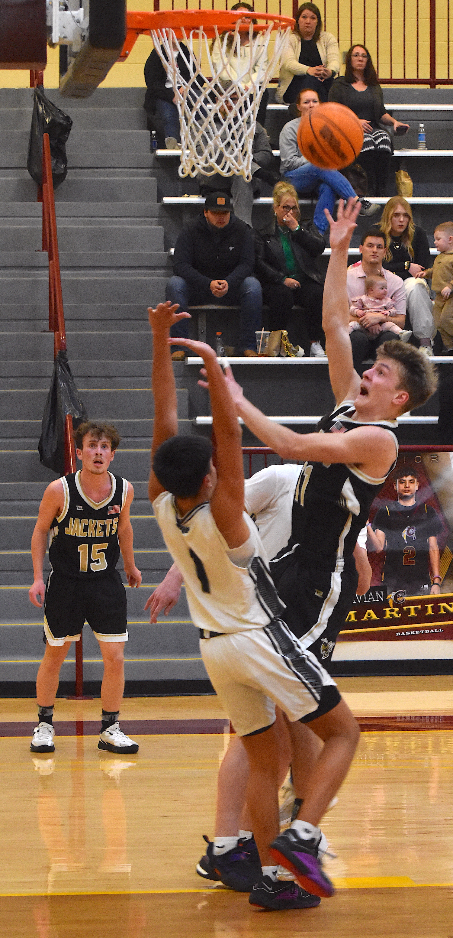 Gary Corsair • Clay County Progress Isaac Chandler, No. 11, powers his way through two Robbinsville defenders for a bucket in the conference tournament.