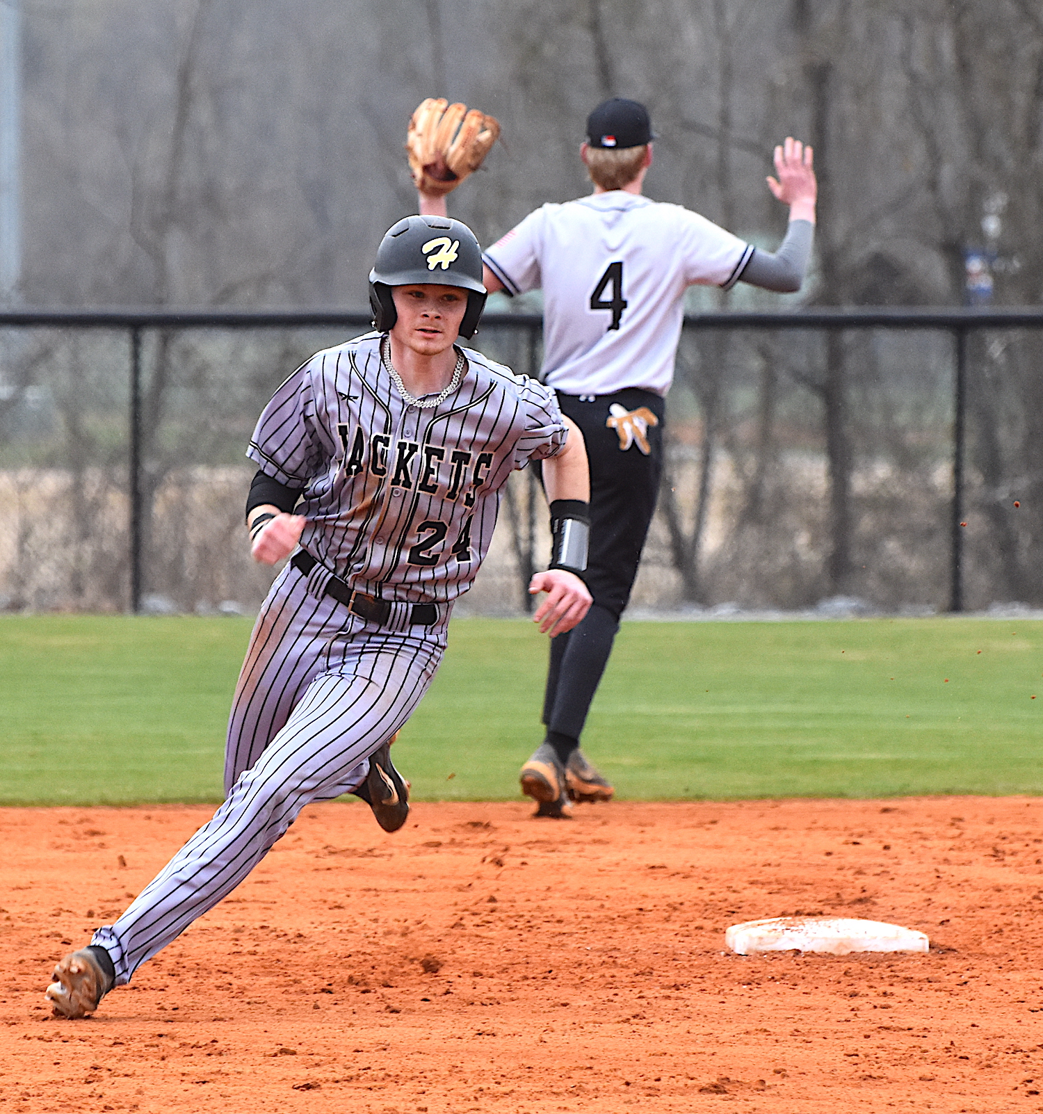 Gary Corsair • Clay County Progress Hayesville's Peyton McGaha rounds second base on a single to right field during the Yellow Jackets' 5-3 win over Pisgah. 