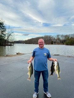 First Place winner and Big Fish Butch Hooper displays a few of his catch.