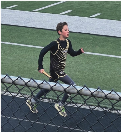 Photo by Carrie Hood Porter Hood sprints to the finish in a relay event.