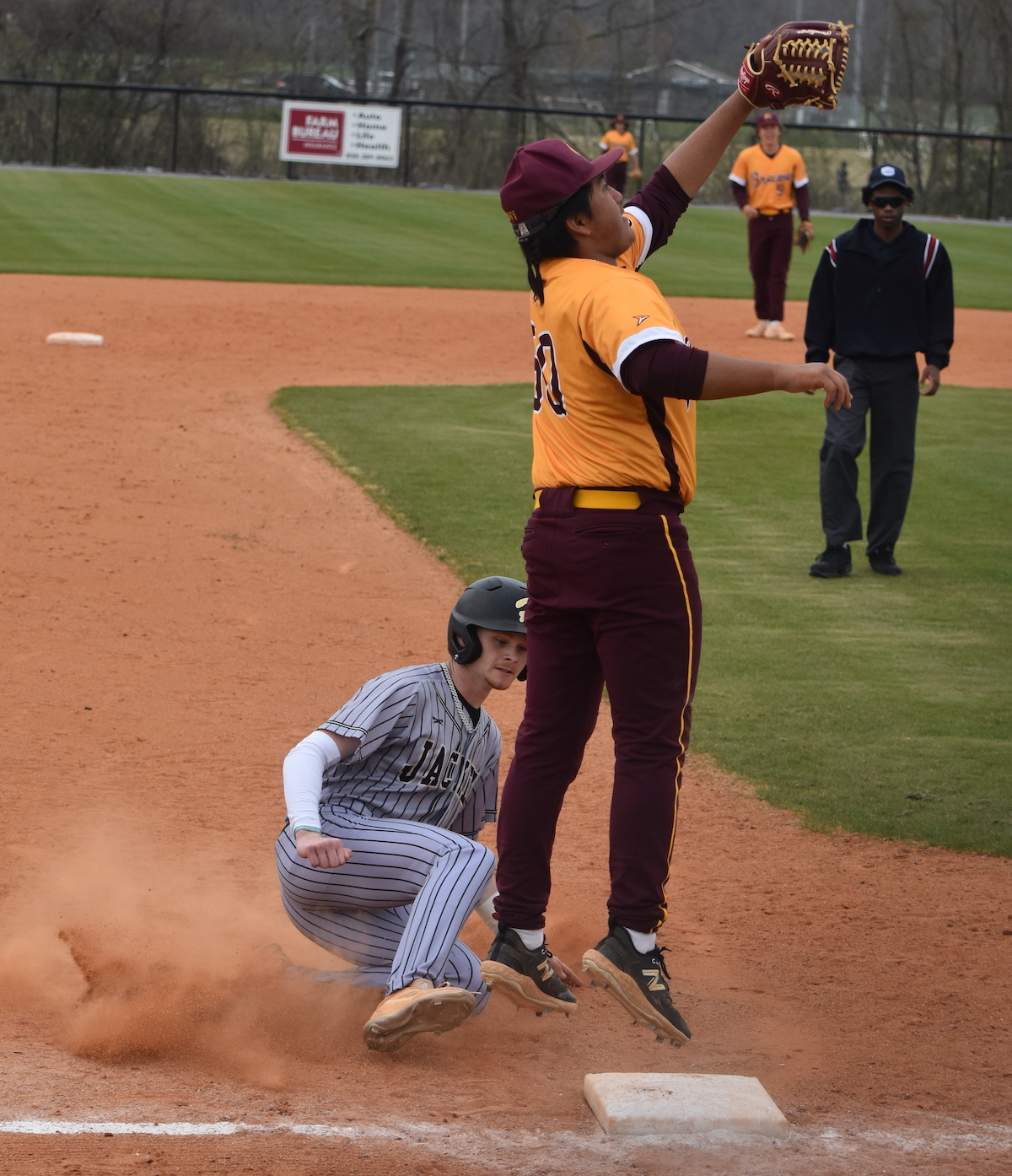 Gary Corsair • Clay County Progress Hayesville's Peyton McGaha hits the dirt as he steals third base well ahead of the throw against Cherokee last Tuesday.