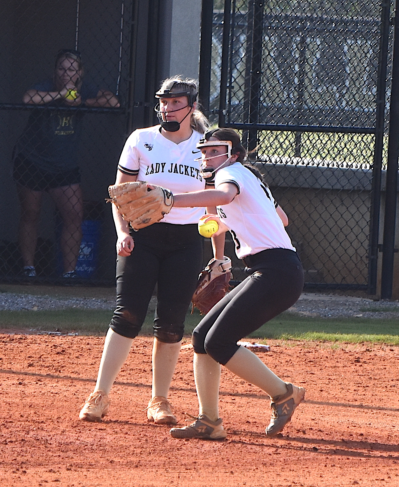 Gary Corsair • Clay County Progress Hayesville shortstop Jasmine Brooks locks and loads after scooping a ground ball she and Danielle Anderson converged on.