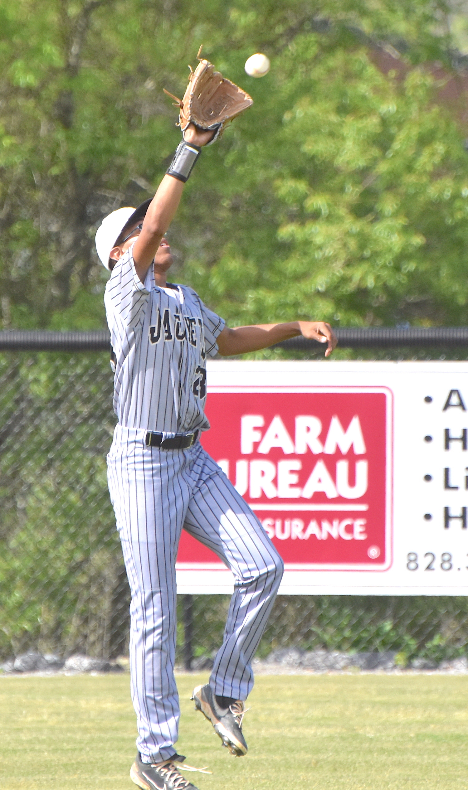 Gary Corsair • Progress Hayesville senior outfielder Shaun Plummer spears a fly ball.