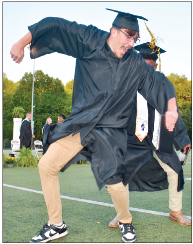 Gracie Taylor • Clay County Progress Jacob Jones, left, and Asher Brown do the happy dance after receiving diplomas during Saturday’s graduation. The duo briefly stopped the ceremony for a spontaneous celebration on the field
