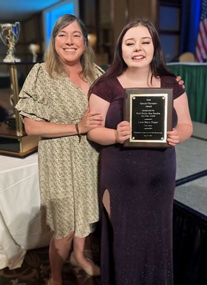 Coordinator Judy Jennings presents Athlete Lana Foster