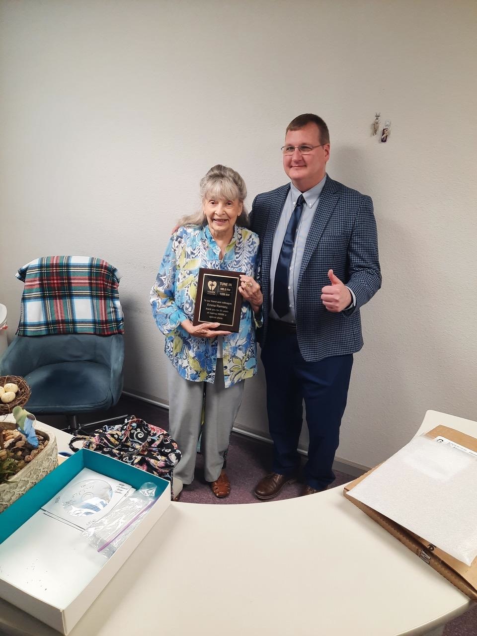 Emma Ramsey was surprised by a plaque given to her on June 27 for 50 years of dedicated service to WKRK radio station by her employer Tim Radford. 