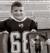 Miranda Shuler’s son Noah in a varsity jersey with the No. 68 worn to honor his friend Layne Jones.