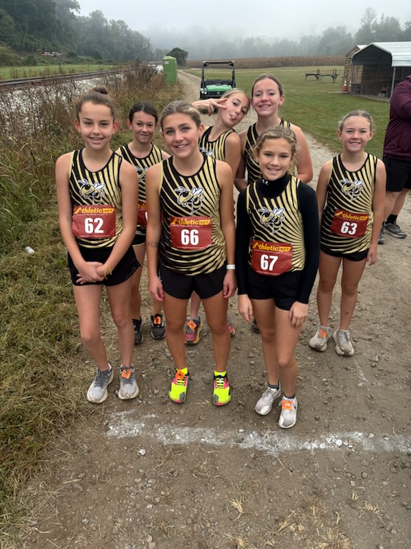 HMS Girls XC Team at the start line are, front from left, Leah Black, Alaina Greenstone and Makenna Moss; back, Shelby Scarbrough, Lily Gordon, Annie Godfrey and Allie Godfrey.