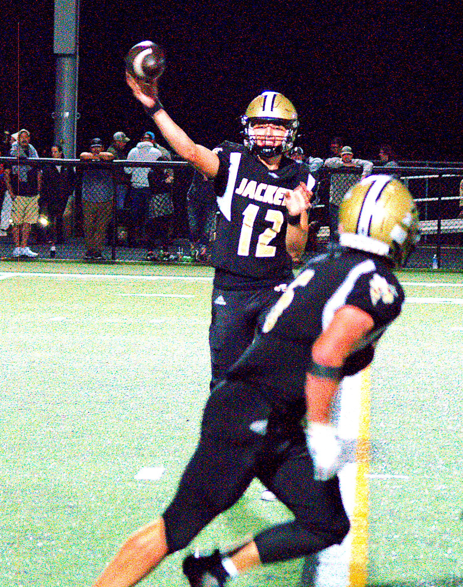 Gary Corsair • Clay County Progress Hayesville quarterback Lance Coker, No. 12, tosses a flare pass to Tre Graves, No. 6.