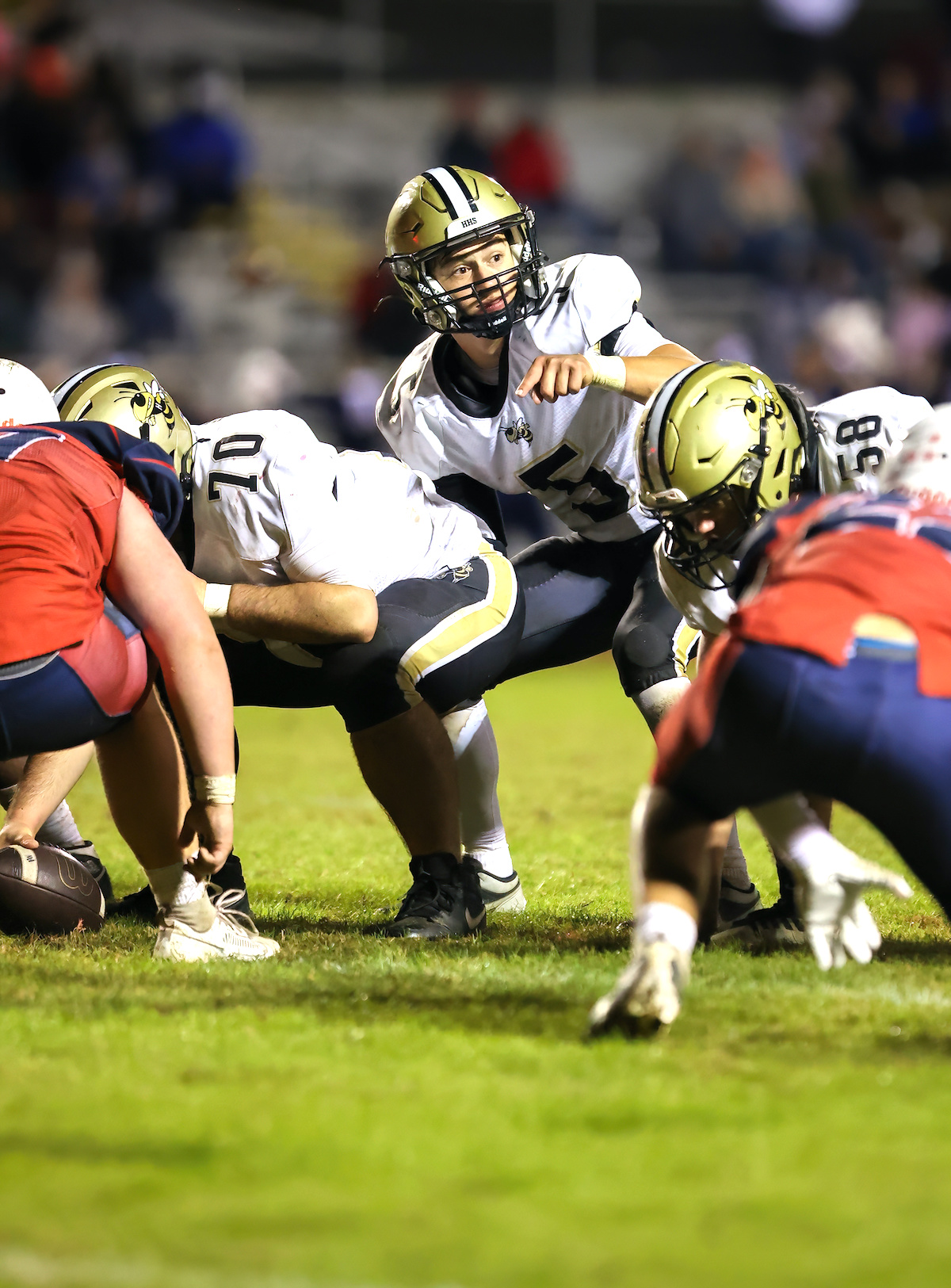 Photo by Marc Lancaster Tate Roberts, No. 5, make sure everyone is on the same page before receiving the snap from center Michael Colandrea, No. 70. 