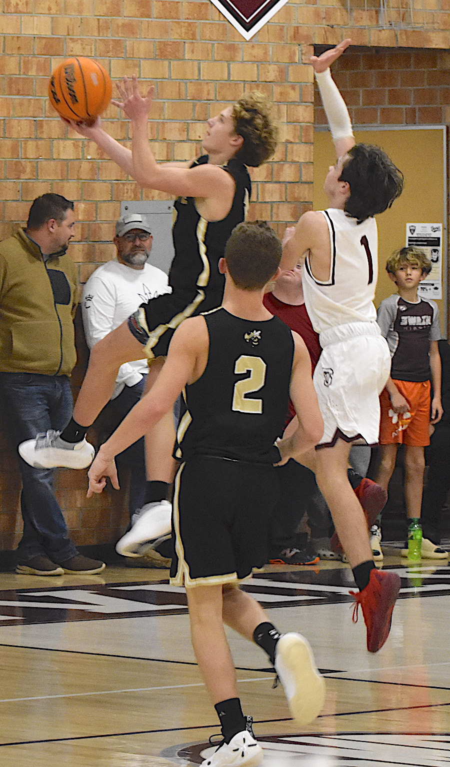 Gary Corsair • Clay County Progress Hayesville guard Kabe Shaheen, No. 3, takes the ball to the hole on a fast break against Swain as Micah Moss, No. 2, watches his running mate.