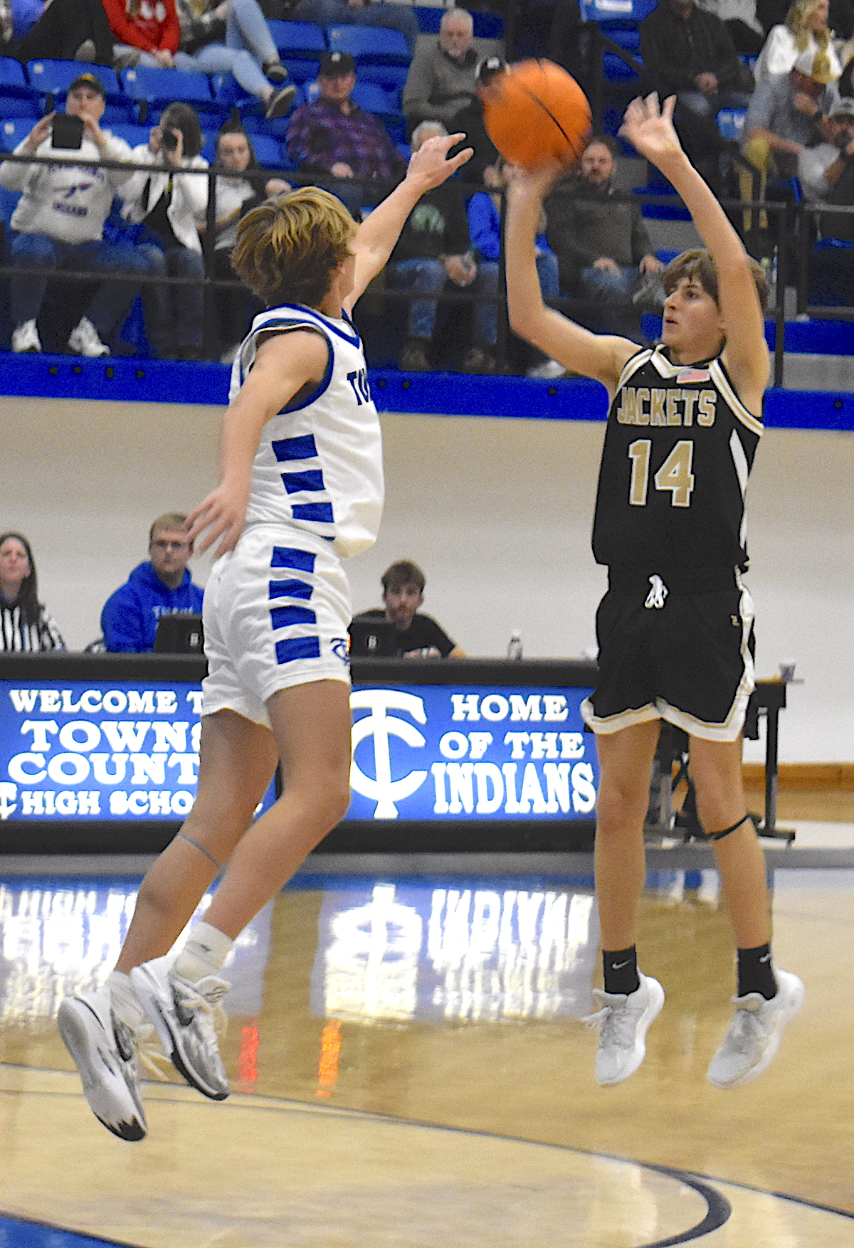 Gary Corsair • Clay County Progress Hayesville's Brady Reynolds, No. 14, delivers his textbook jumper for 3 at Towns County. 