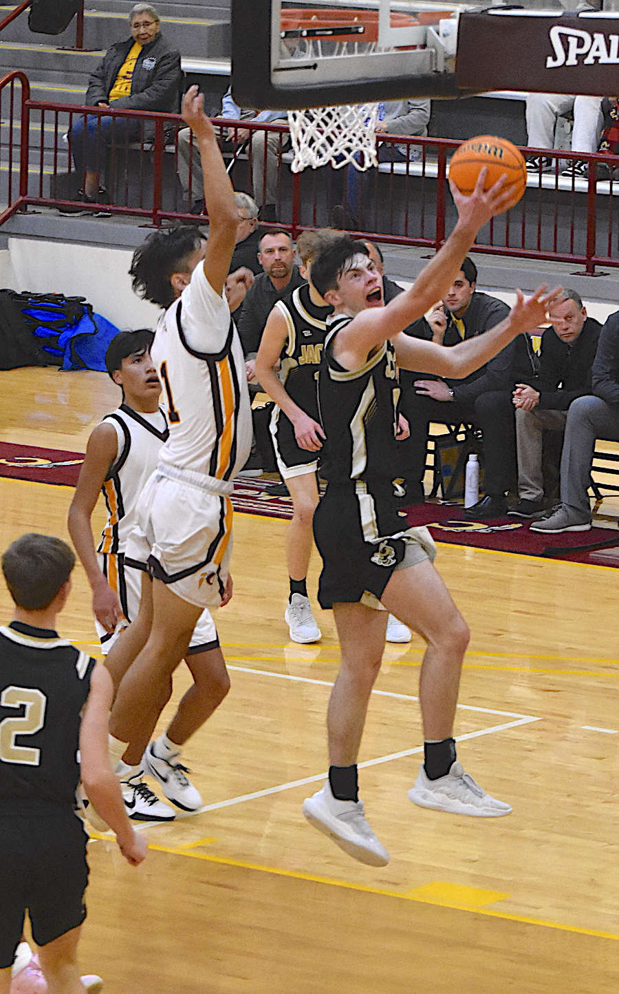 Gary Corsair • Clay County Progress Slade Crouch, No. 2, glides past Cherokee defenders to tally 2 for Hayesville on a reverse layup.