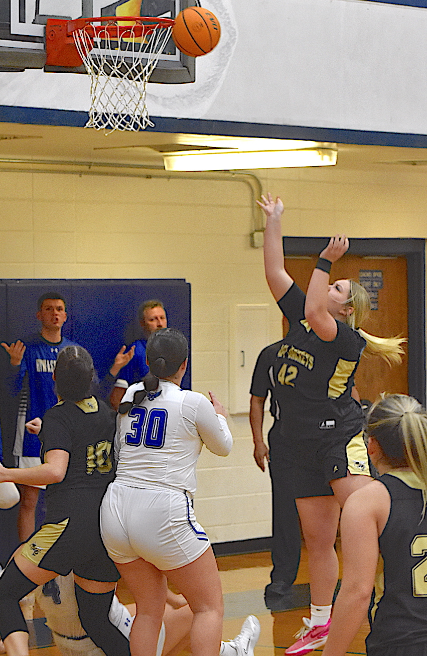 Gary Corsair • Clay County Progress Ava Moore, No. 42, punishes Hiwassee Dam's defense with a basket as Bryleigh Krieger, No. 10, establishes position.
