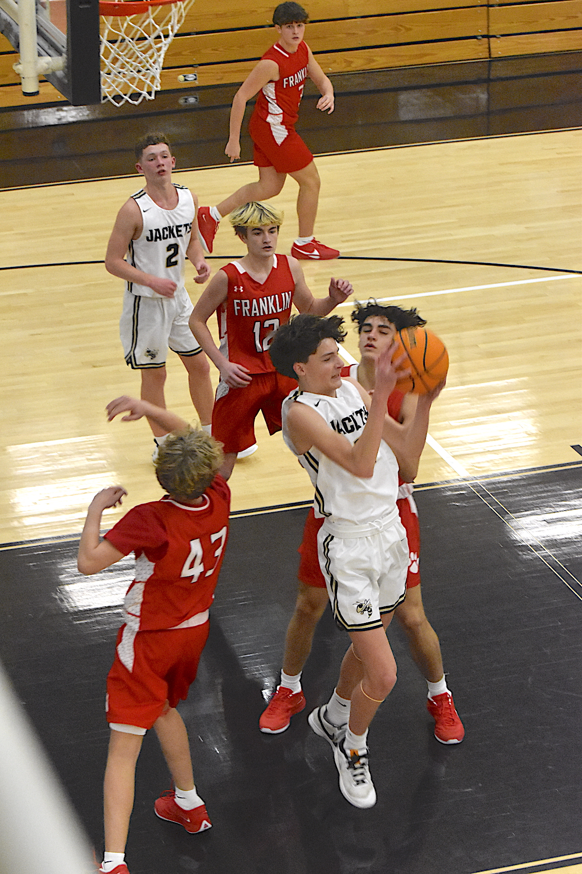 Gary Corsair • Clay County Progress Donivin Soto retains possession of the ball for Hayesville with this impressive rebound in a crowd of Franklin Panthers in JV basketball action.