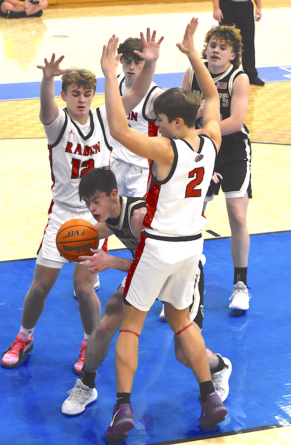 Gary Corsair • Clay County Progress Rabun County defenders try to cage Hayesville's Mr. Offense Slade Crouch, No. 3.