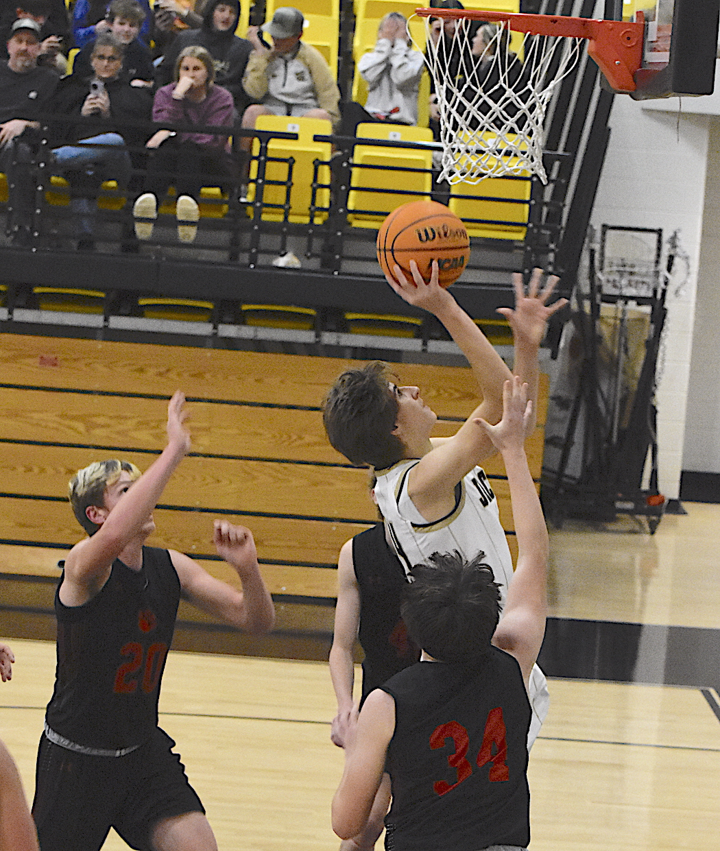 Gary Corsair • Clay County Progress Hayesville's Brady Reynolds, No. 14, slips through Franklin's defense for 2 of the 60 points he scored last week.