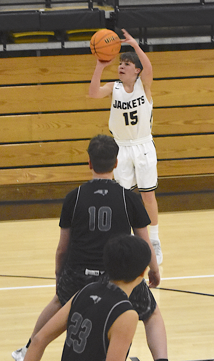 Gary Corsair • Clay County Progress Byron Engelman, No. 15, bombs a 3-pointer for Hayesville in the championship game of the Smoky Mountain Conference JV Basketball Tournament.