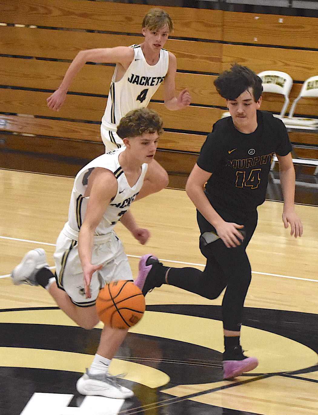 Gary Corsair • Clay County Progress Hayesville floor general Kabe Shaheen, No. 3, motors downcourt on the way to a layup as Micah Moss, No. 2, trails the play.