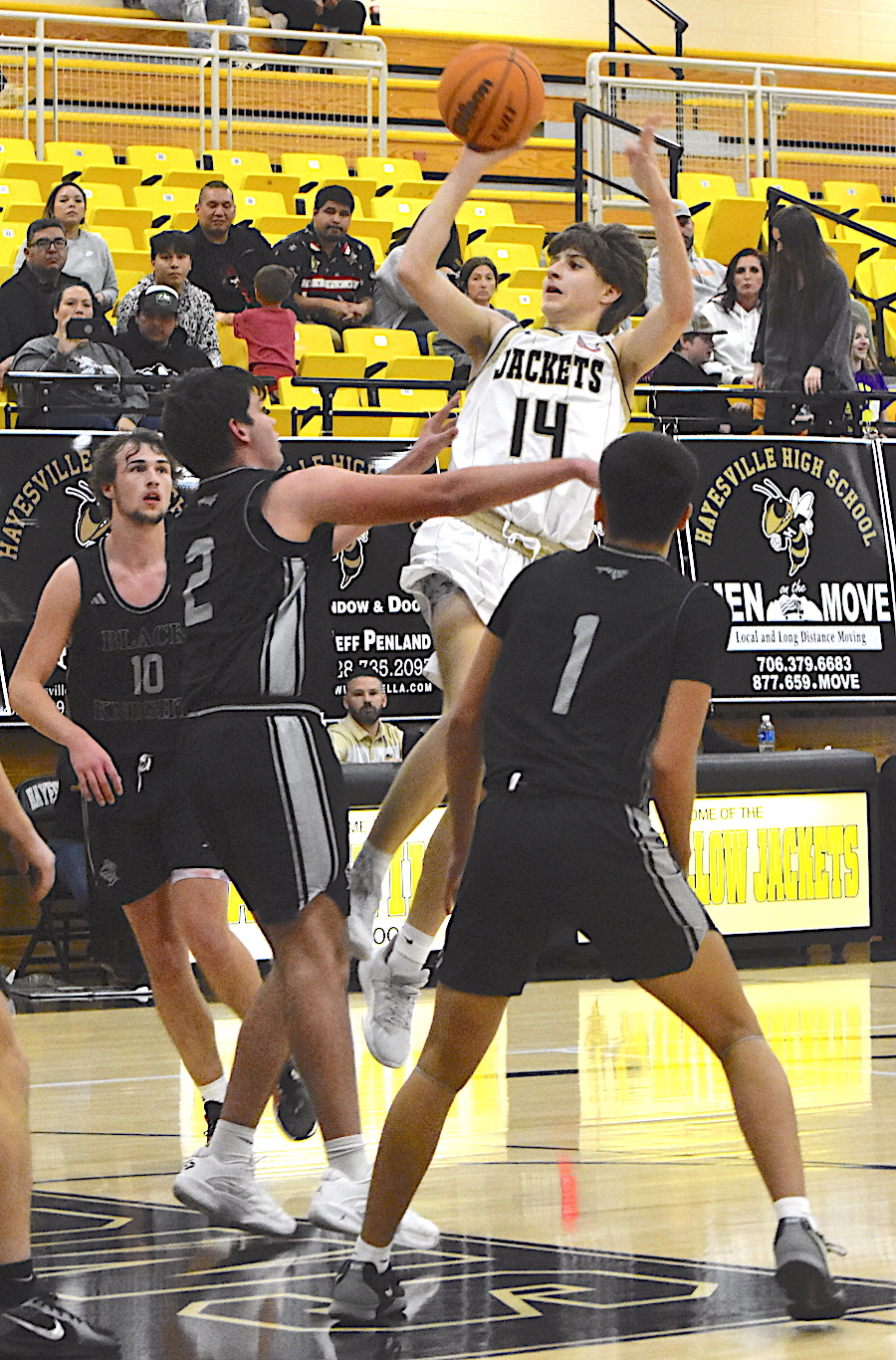 Gary Corsair • Clay County Progress Brady Reynolds, No. 11, gives Hayesville two points on his trademark one-handed floater against Robbinsville.