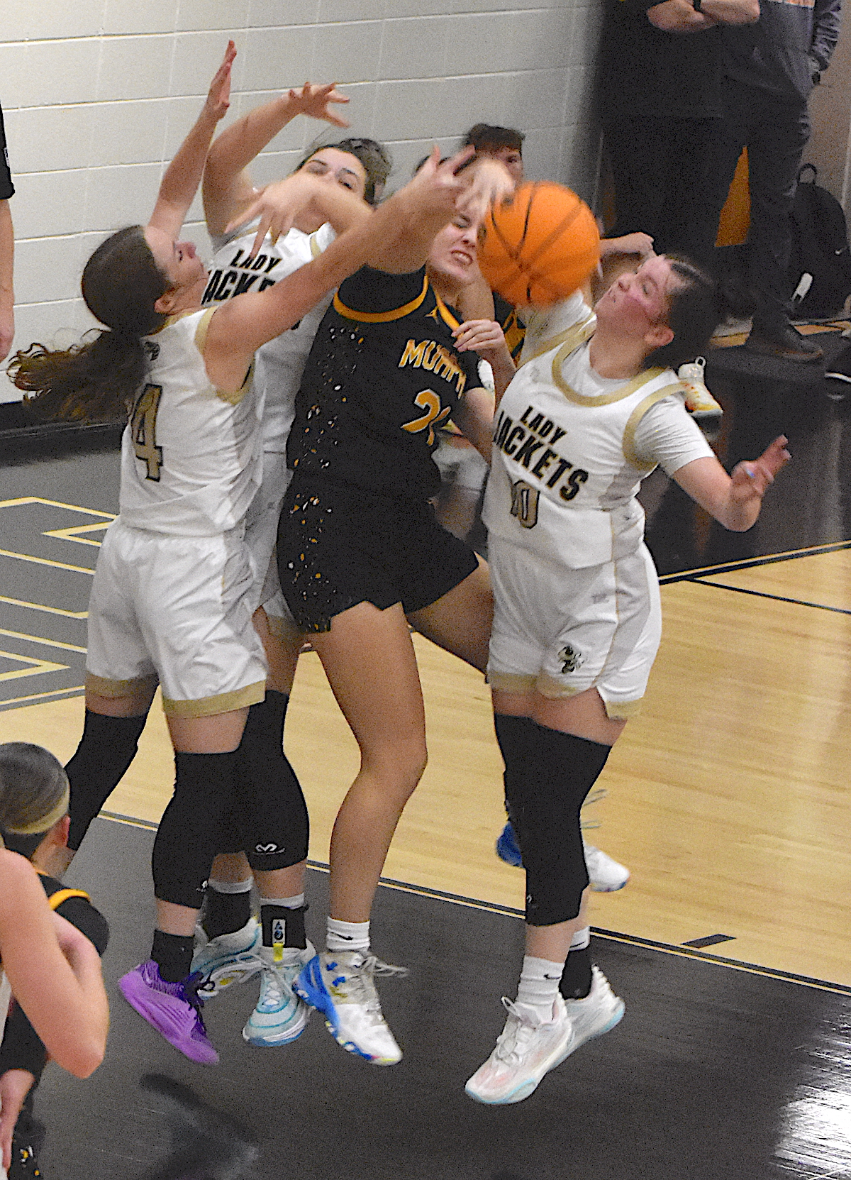 Gary Corsair • Clay County Progress Hayesville shows Murphy that you must pay when you go inside against the Lady Jackets. Breanna Abrams, No. 4, Kayla Brown and Bryleigh Krieger, No. 10, do the teaching. 