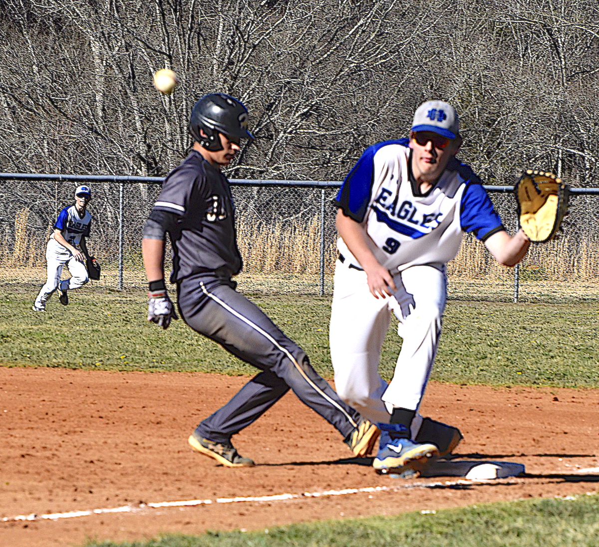 Gary Corsair • Clay County Progress Yellow Jacket shortstop Tate Roberts, No. 11, scampers back to first base during a botched pickoff attempt.