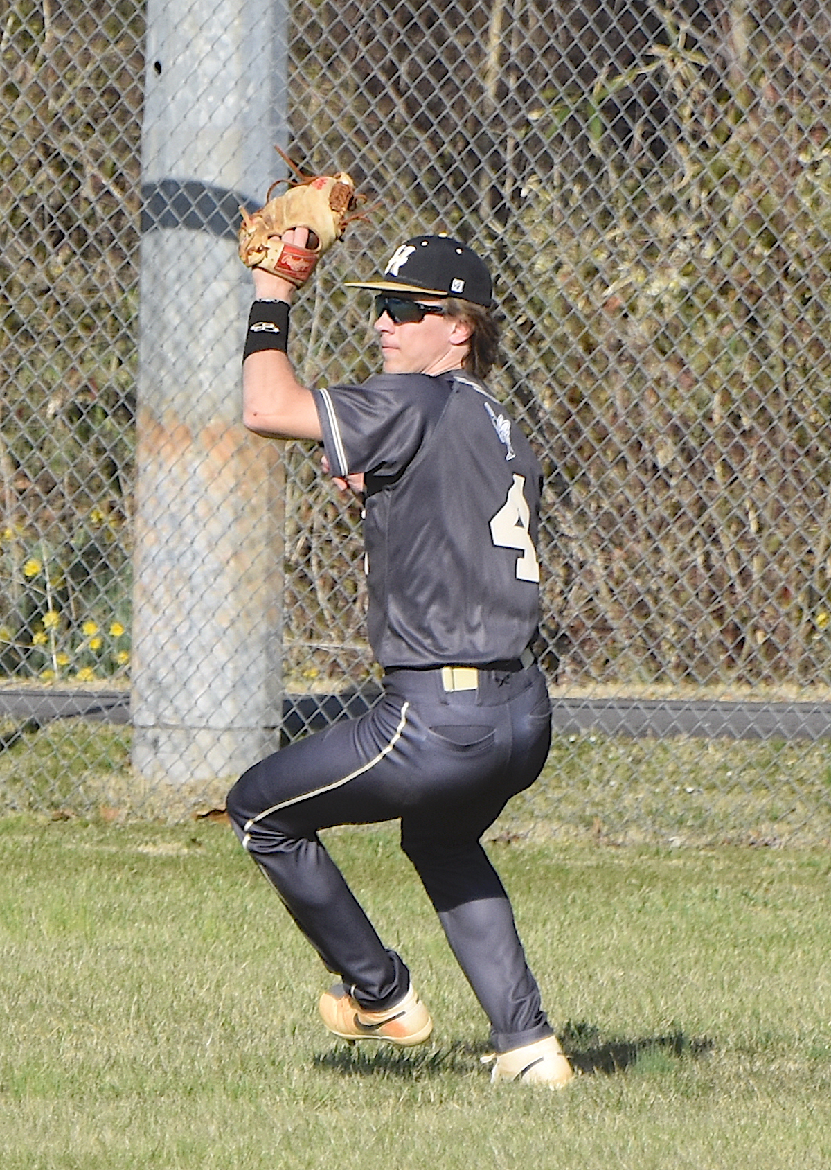 Gary Corsair • Clay County Progress Hayesville outfielder Kendall Boyer, No. 4, checks the cutoff man and prepares to throw after gathering a long fly ball against Andrews.