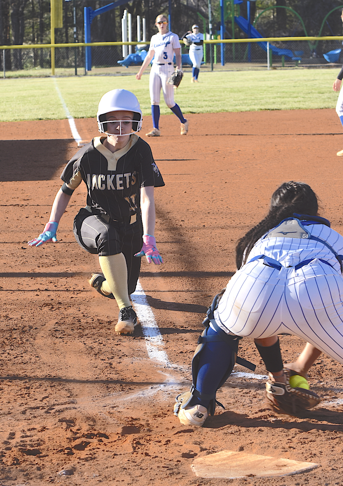 Gary Corsair • Clay County Progress Hayesville's Raylyn Taylor, No. 11, begins a head-first slide as she attempts to score in the fifth inning against Smoky Mountain. Unfortunately, Taylor was tagged out on an inning-ending double play.