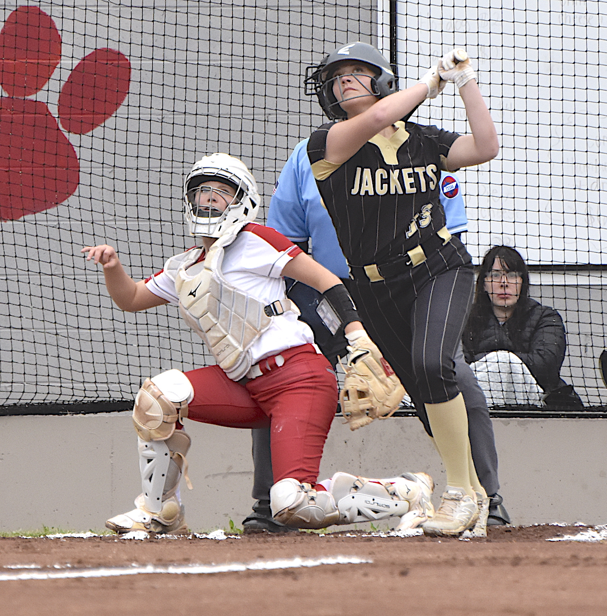 Gary Corsair • Clay County Progress All eyes are on the ball sailing into the outfield as Hayesville's Lillie McClure connects for a third-inning double to tie the score at 2.