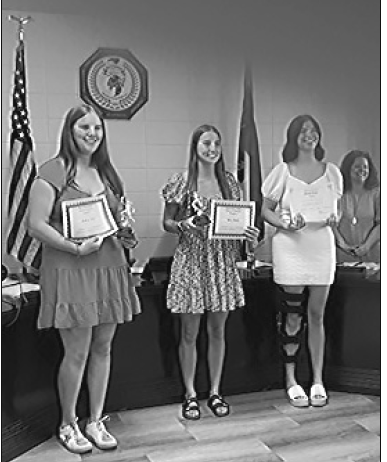 Marcia Barnes • Clay County Progress Clay County Schools Board of Education honored outstanding student athletes, from left, Mallory Peck, Ava Shook, Bryleigh Krieger, board members Kelly Crawford and Josh Ashe, during the regular meeting on May 19. All three were recognized for Women’s 2024/2025 Basketball All Smoky Mountain Conference.