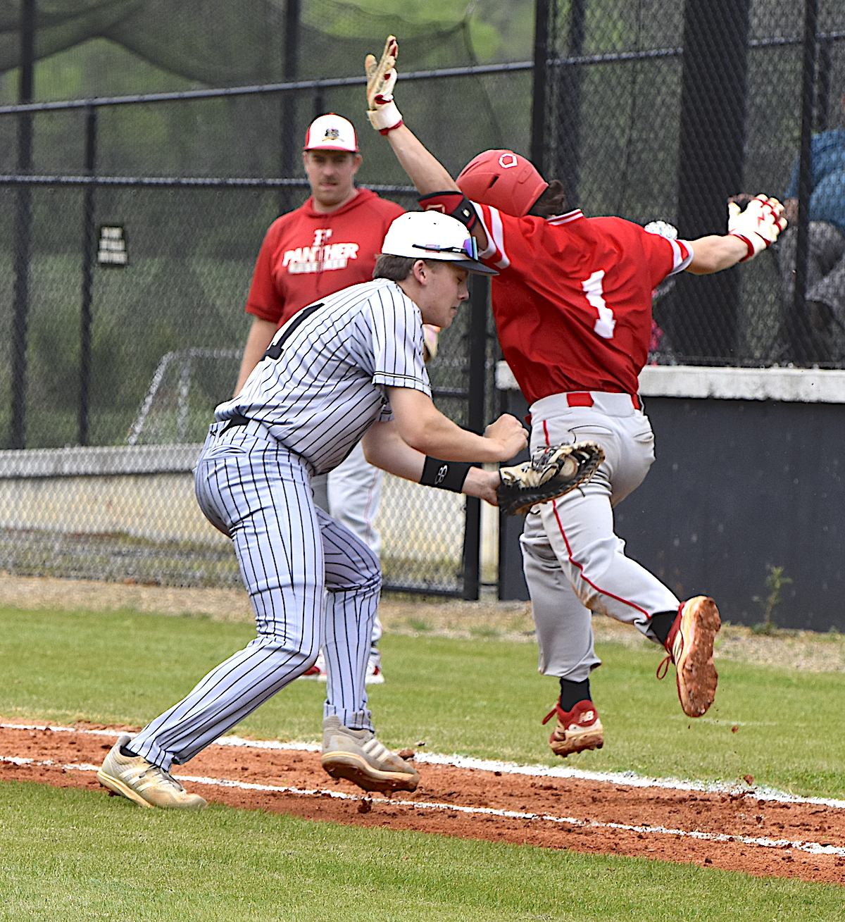 Gary Corsair • Clay County Progress Yellow Jacket first baseman Jackson Sellers is a split second too late as tries to apply the tag on an infield dribbler.