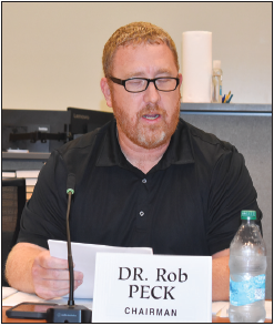 Becky Long • Clay County Progress Commission Chairman Rob Peck reads a prepared statement regarding questions concerning the solid waste use/ availability fee which is itemized on the 2025 tax listings. 