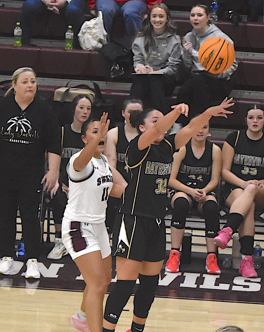 Gary Corsair • Clay County Progress Aaliyah Jackson, No. 32, dials three long-distance for Hayesville during the Lady Jackets’ runaway win over Swain County. 