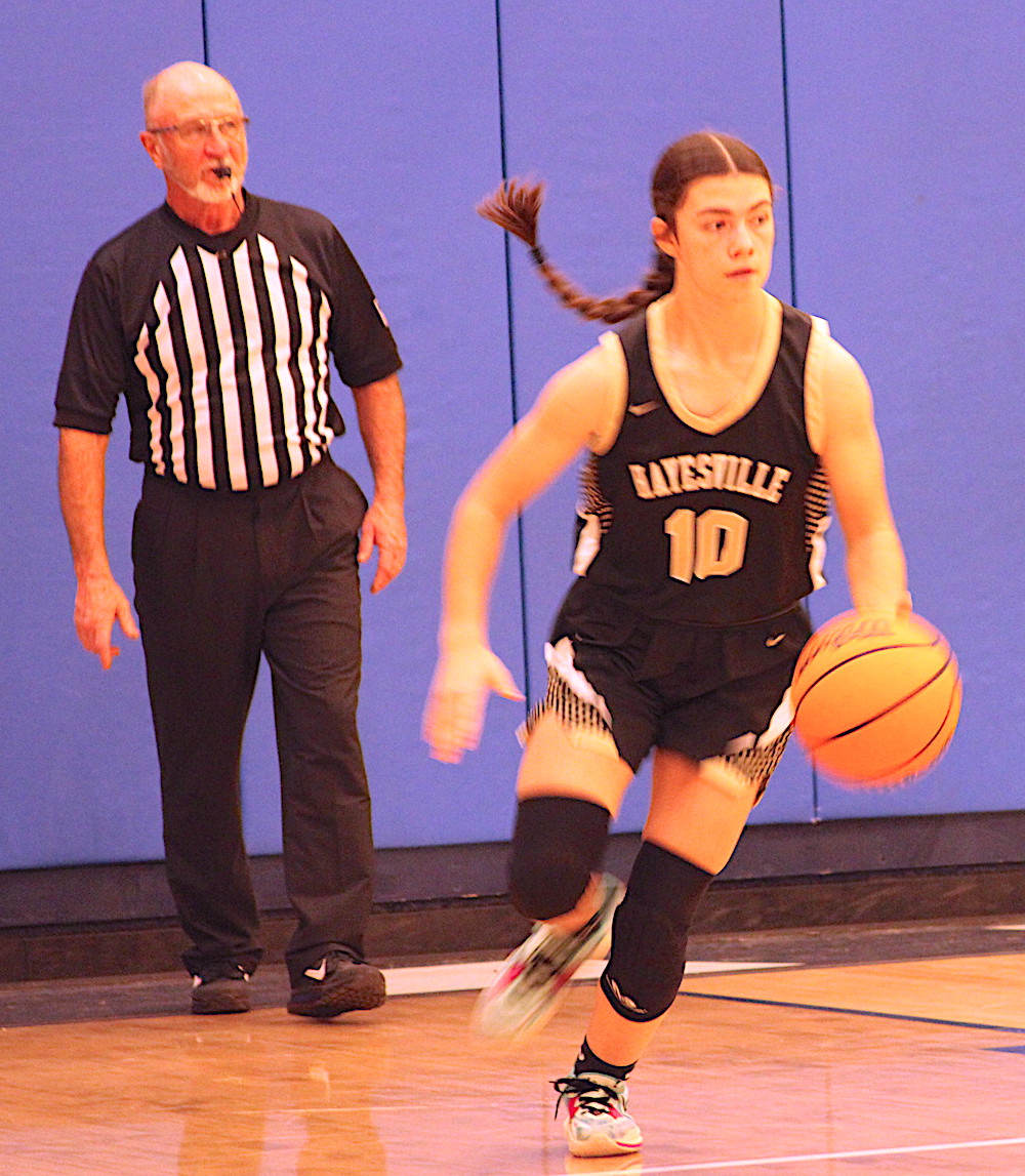Neal Wachob • Clay County Progress Pony tail-a-flappin' Micalynn McClure, No. 10, triggers a Hayesville fast break against Nantahala.