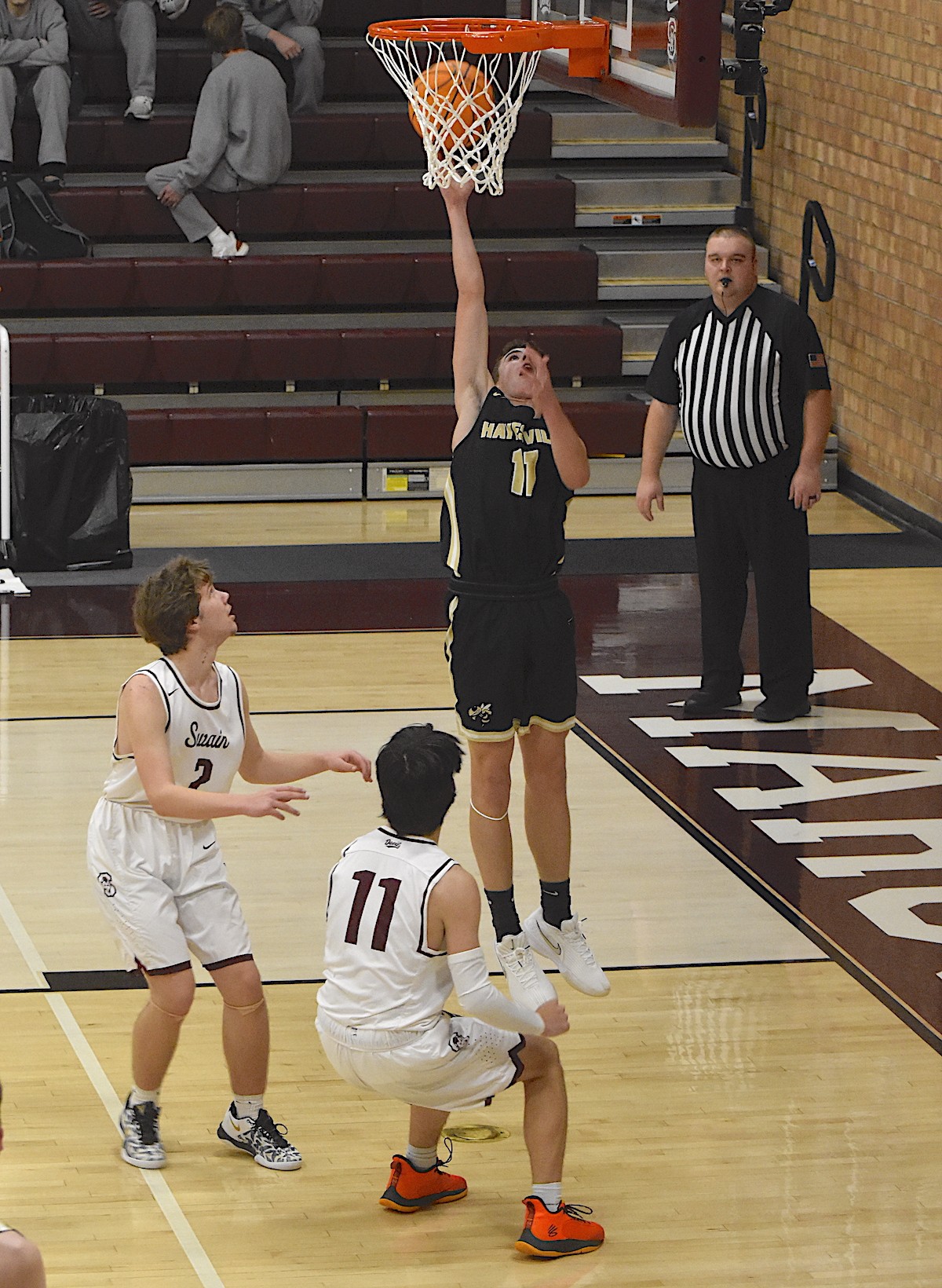 Gary Corsair • Clay County Progress Hayesville’s Eli Cheeks, No. 11, goes up strong after slipping through the Swain defense. 