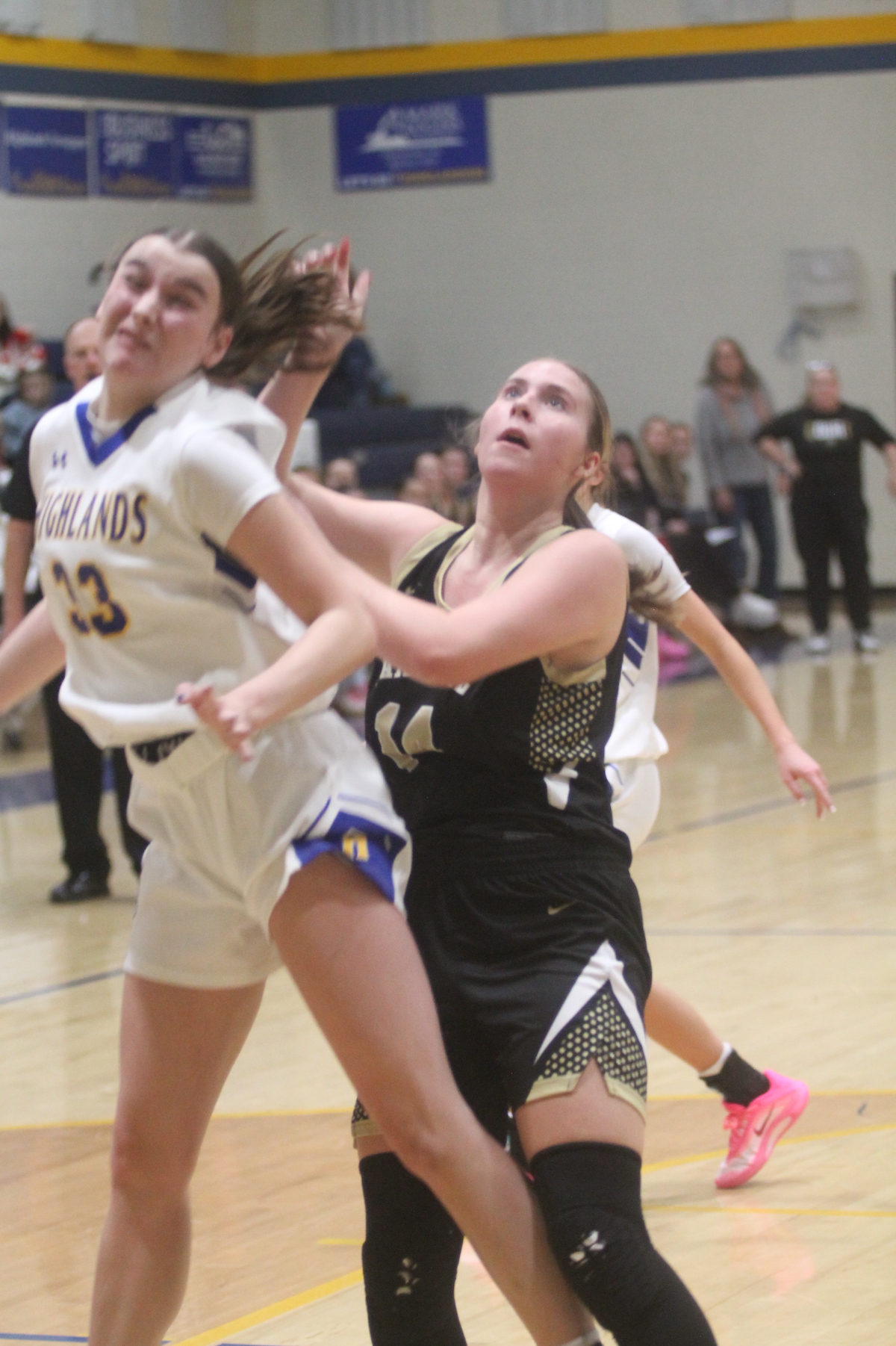Josh Bryson • Photo Hayesville's Briley Clampitt, No. 14, "relocates" Highlands center Hunter Conner as the two fight for rebounding position.