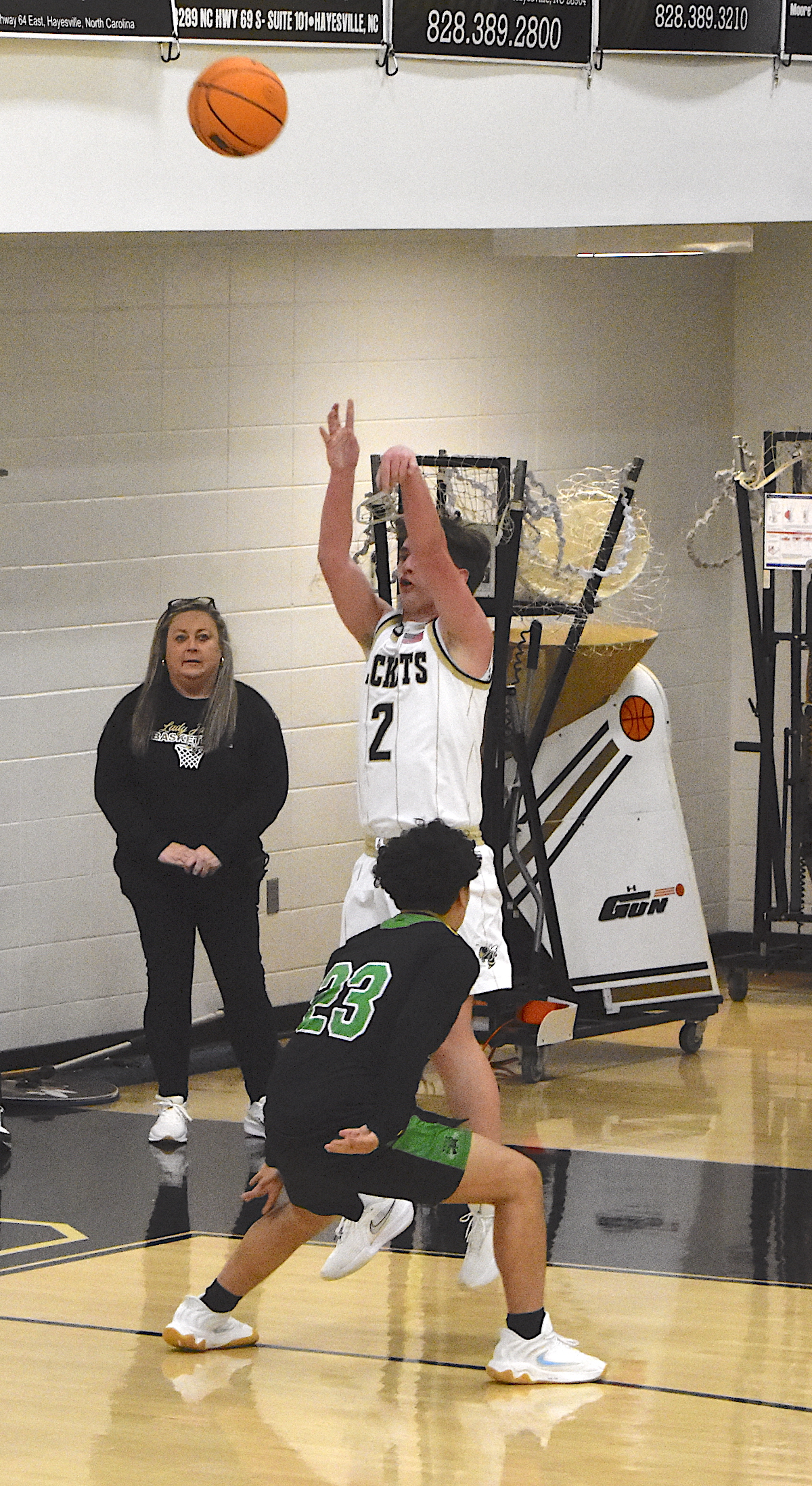 Gary Corsair • Clay County Progress Lethal lefty Brady Jones, No. 2, launches a three-pointer from the corner during a momentous fourth quarter that saw the Hayesville eagle eye stroke six treys, one short of the state record.