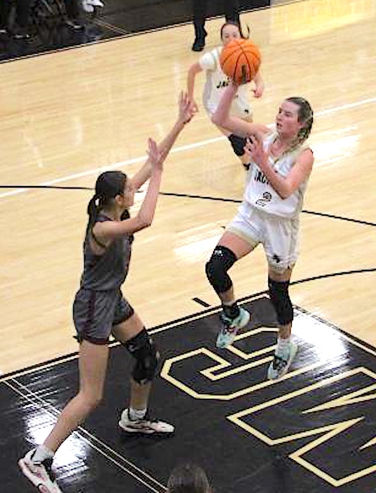 Neal Wachob • Clay County Progress Ava Shook, No. 3, lofts a floater for a Hayesville basket against Swain County.