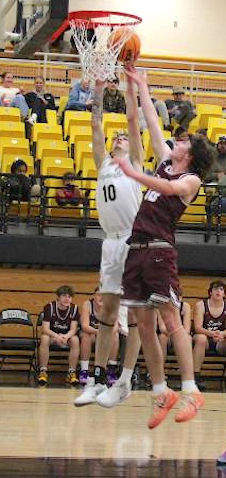 Neal Wachob• Clay County Progress Brendan Lynch, No. 11, takes the rock to the hole for a deuce in Hayesville's big win over Swain.
