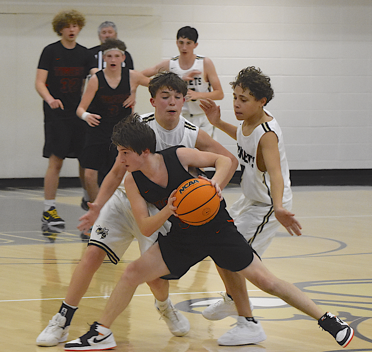 Gary Corsair • Clay County Progress Hayesville guards Byron Engelmann and Peyton Cordell apply pesky pressure against Rosman in JV basketball action Friday while Jackets big man Grant Baldwin protects the paint.