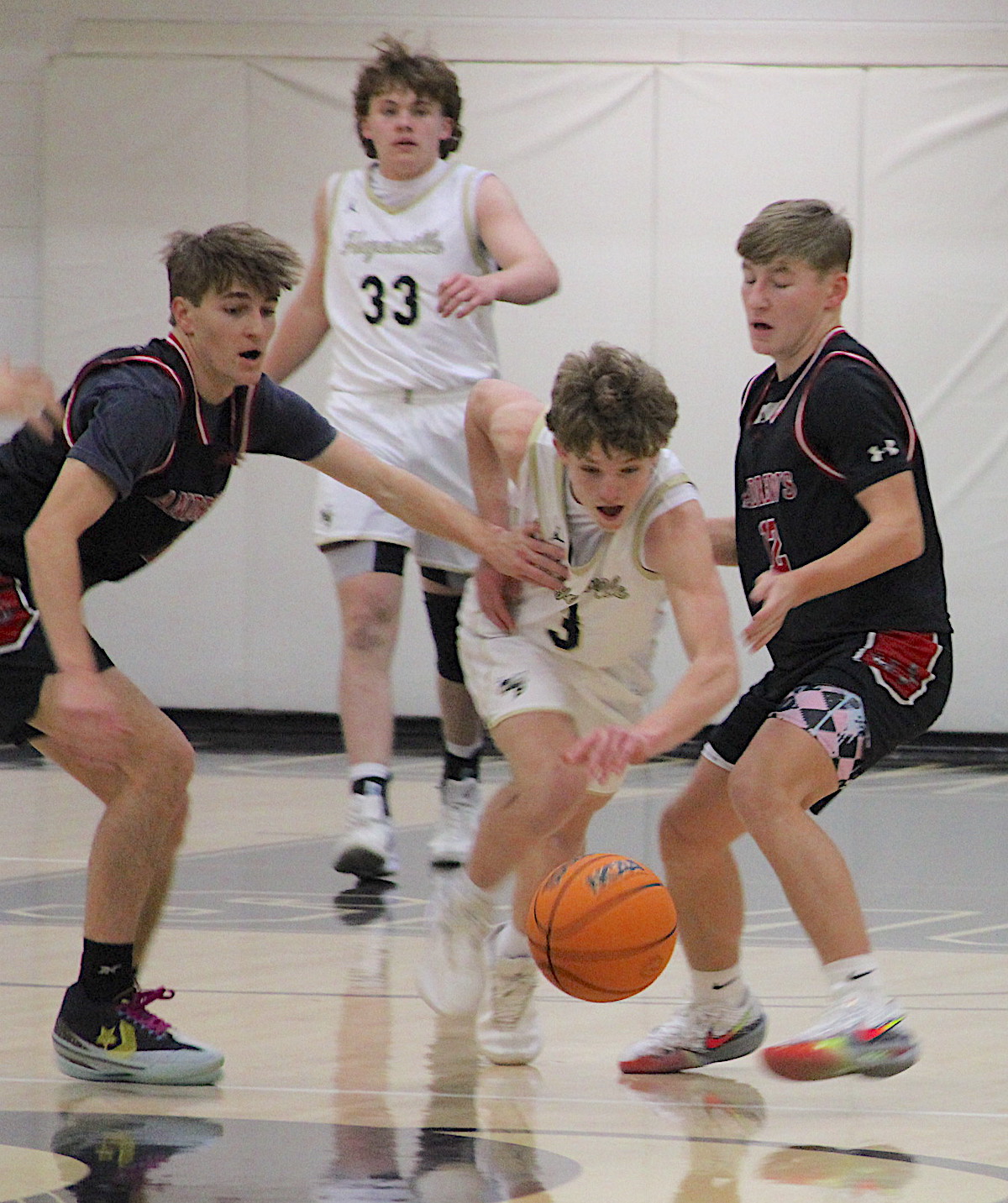 Neal Wachob • Clay County Progress Hayesville point guard Kabe Shaheen, No. 3, slithers through a trap set by Andrews. 