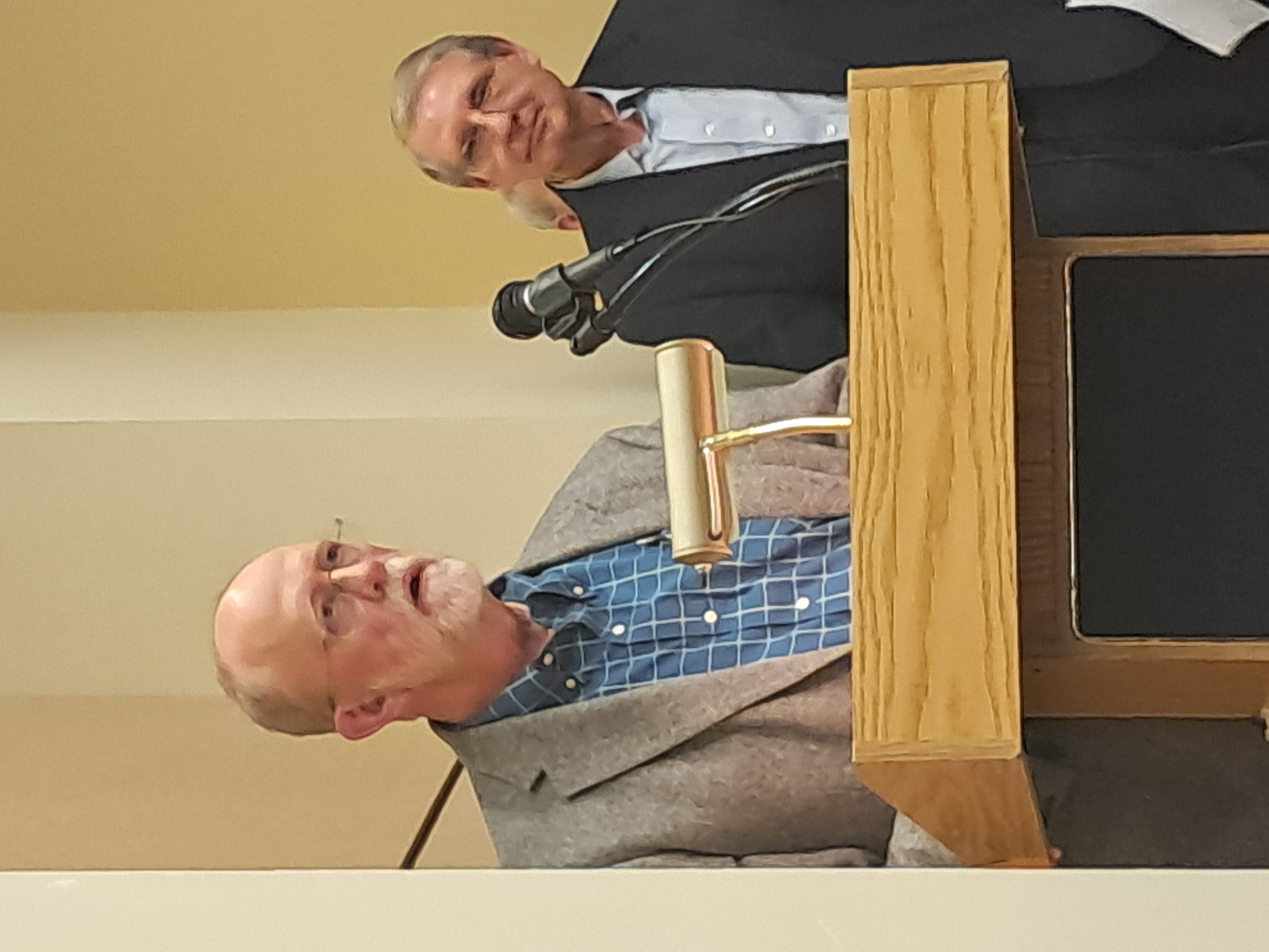 Becky Long • Clay County Progress John Pratt speaks against the current route for substation/transmission line project while Jim Rich awaits his turn at the podium.