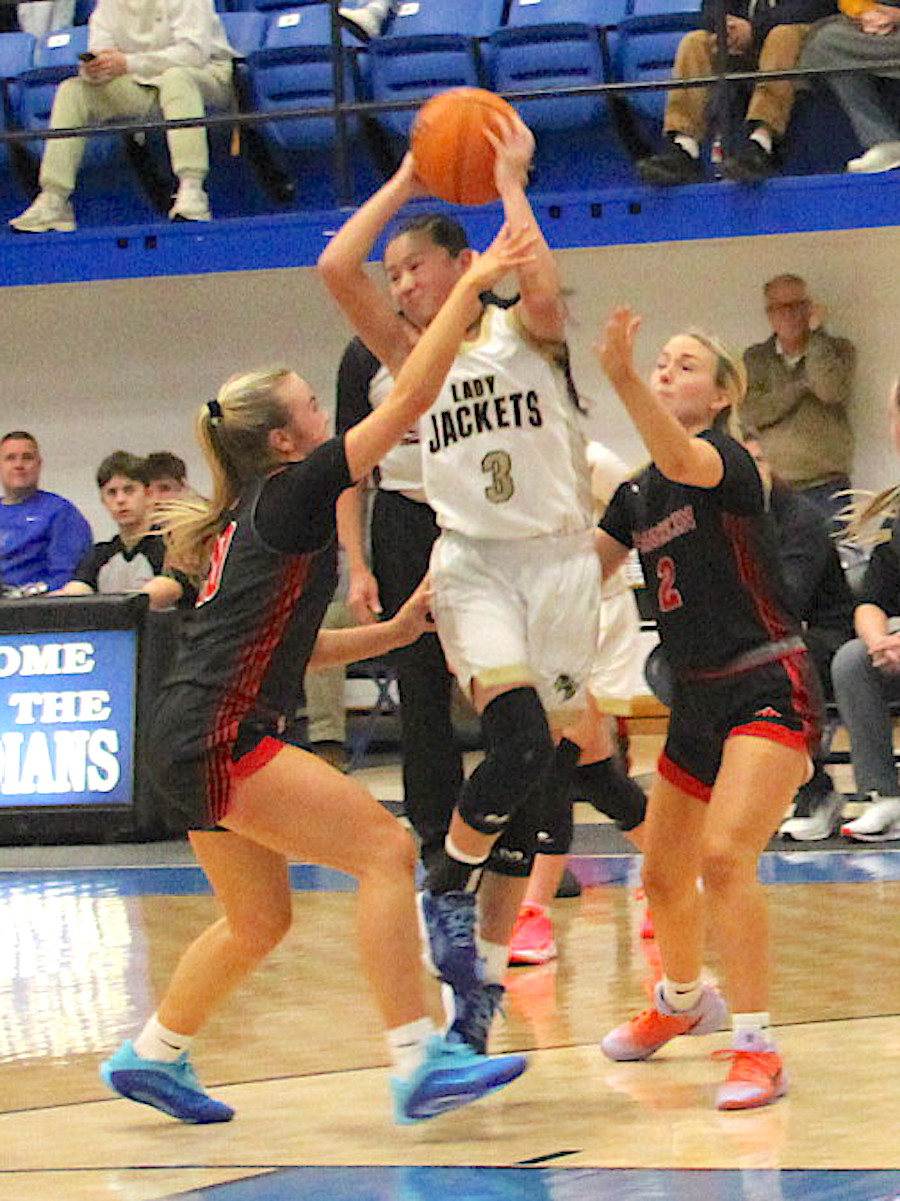 Neal Wachob • Clay County Progress Hayesville dynamo Lucy Trout, No. 3, splits the Andrews defense on the way to the hoop.