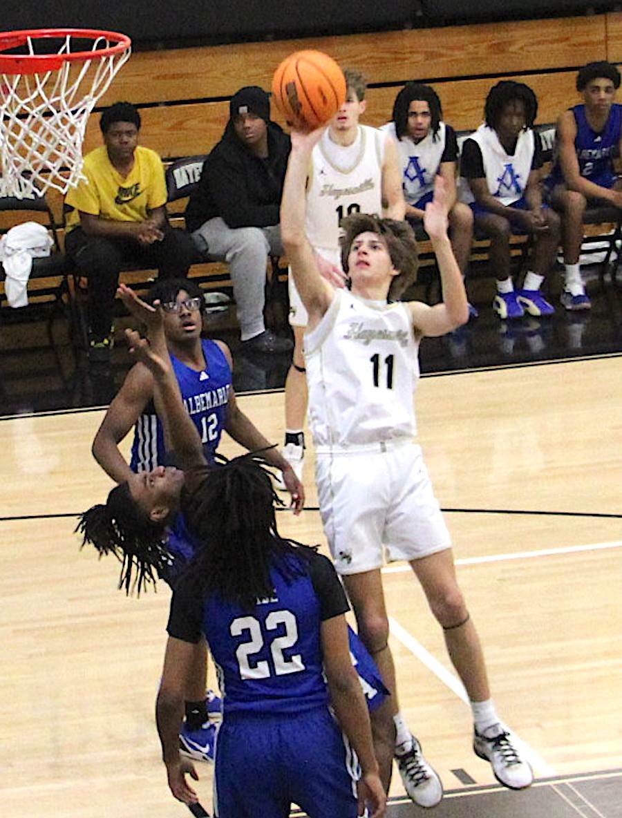 Neal Wachob • Clay County Progress Hayesville sharpshooter Brady Reynolds, No. 11, lofts a one-hander during the shooting clinic he conducted against Albemarle.