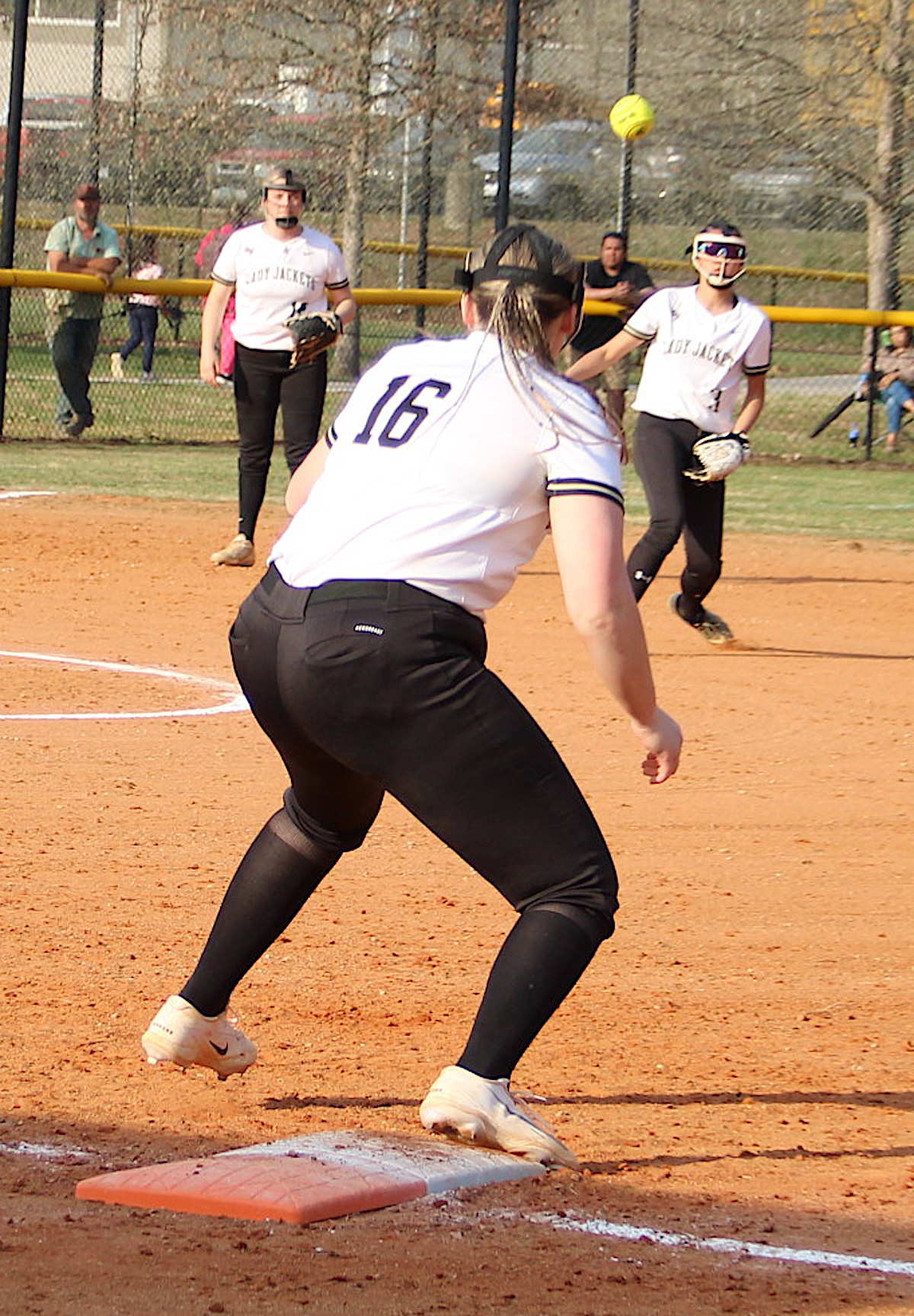 Neal Wachob • Clay County Progress Hayesville first baseman Danielle Anderson, No. 16, reaches for the throw from short stop Lucy Trout.