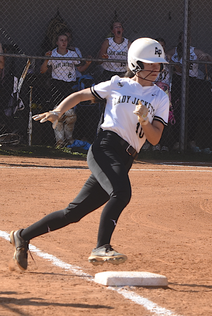 Hayesville's Micalynn McClure, No. 10, hits high gears as she motors around first base on the way to a double at Hiwassee Dam.