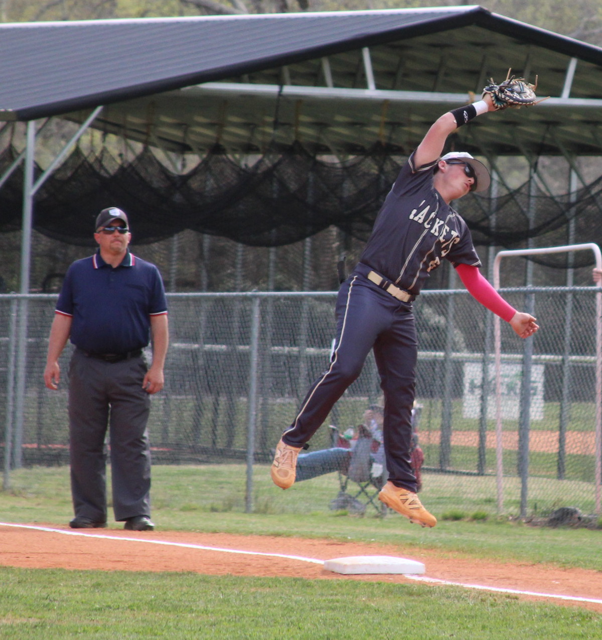 Neal Wachob • Clay County Progress Hayesville first baseman Landon Cheeks goes airborne to snag a throw against Murphy.